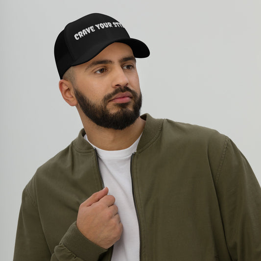 Six-panel mesh back trucker cap with permacurv visor and adjustable closure